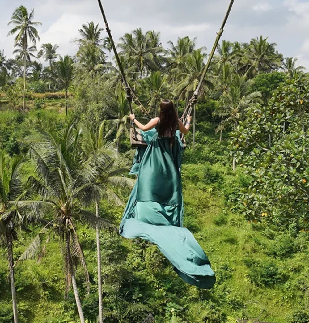 A guest on a jungle swing above the rice terraces